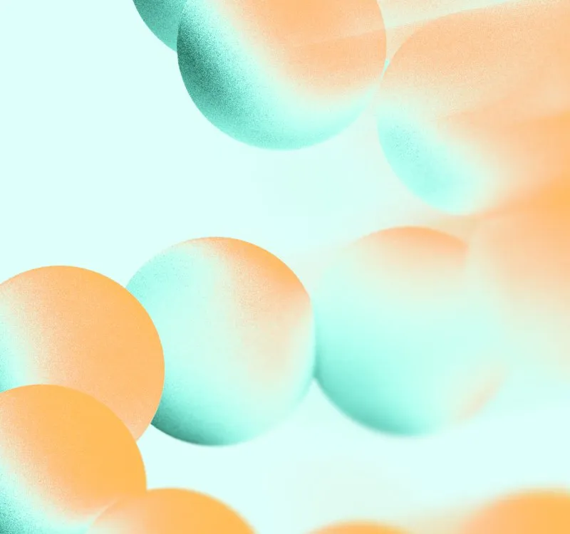 Abstract mint and orange spheres cascading